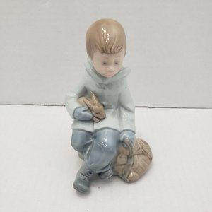 NAO by Lladro Figurine Boy Restingon Excursion Exclusive holding a Rabbit /Bunny